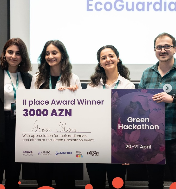 Green Stone team with award